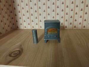 Freistehender grauer Ofen 1:12 ohne Rohr
